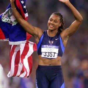 'Admitting' her drug use ... Marion Jones of the United States celebrates after winning the gold medal in the 100m at Olympic Stadium in Sydney.